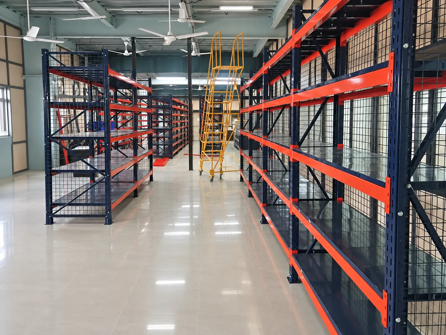 Warehouse racking with mesh sides and red beams.