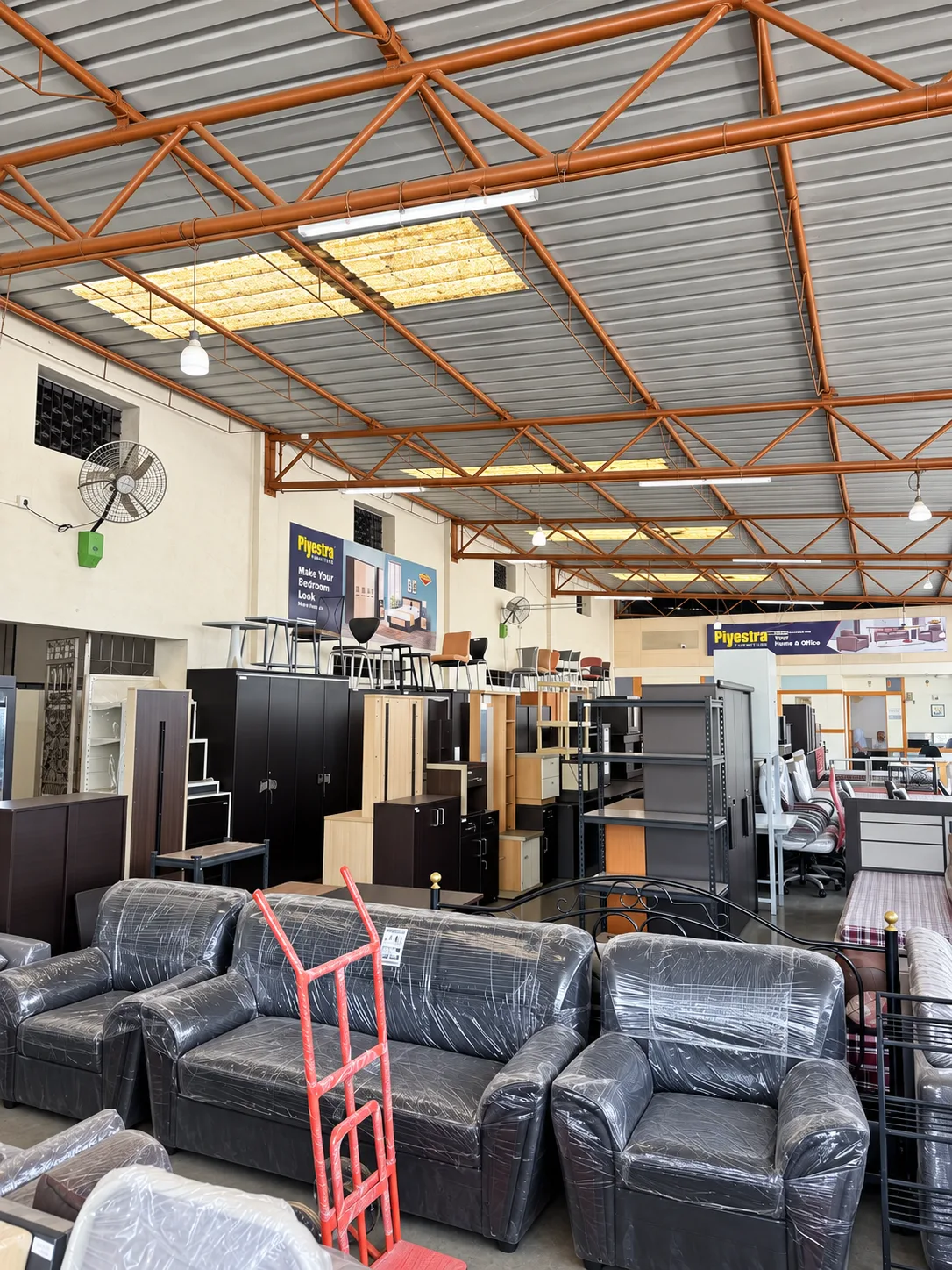 Sofas and other furniture brands displayed in the Abhay Steel showroom