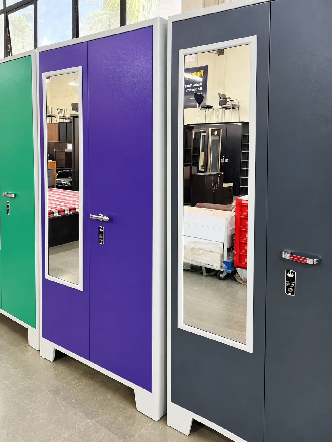Cupboards on the showroom floor, in the colours we powder-coat.