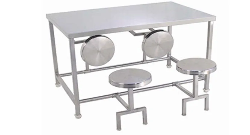 Stainless steel canteen table with four attached stools.