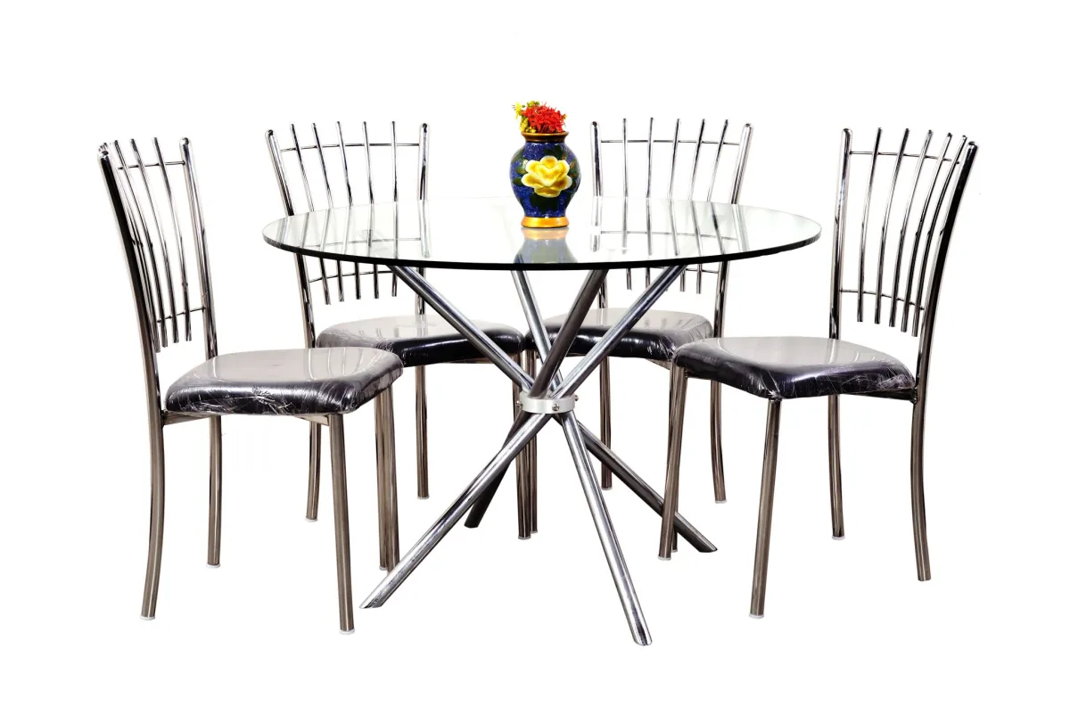 Glass top dining table with four steel chairs.