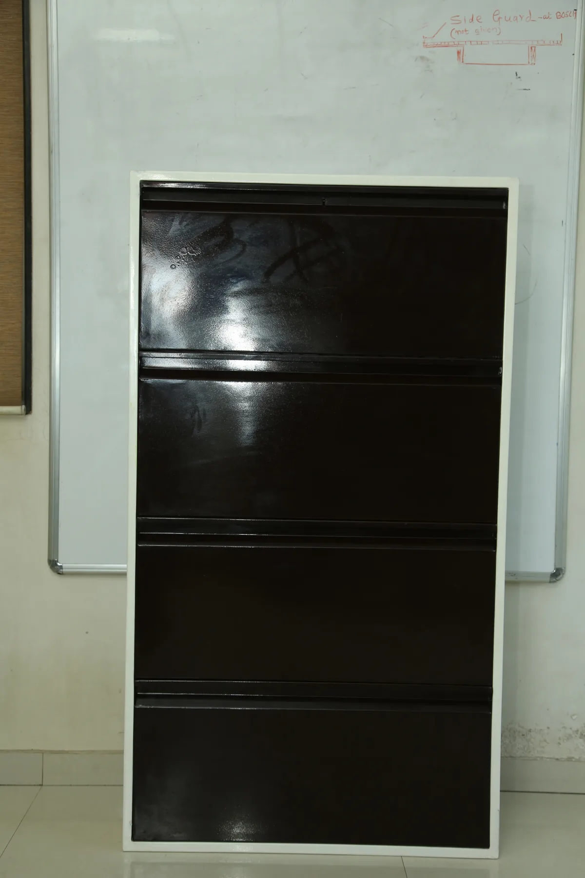 Horizontal four drawer filing cabinet.