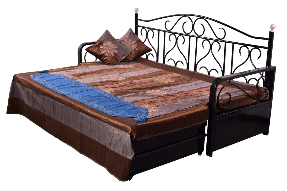 Wrought iron diwan that opens out into a bed.