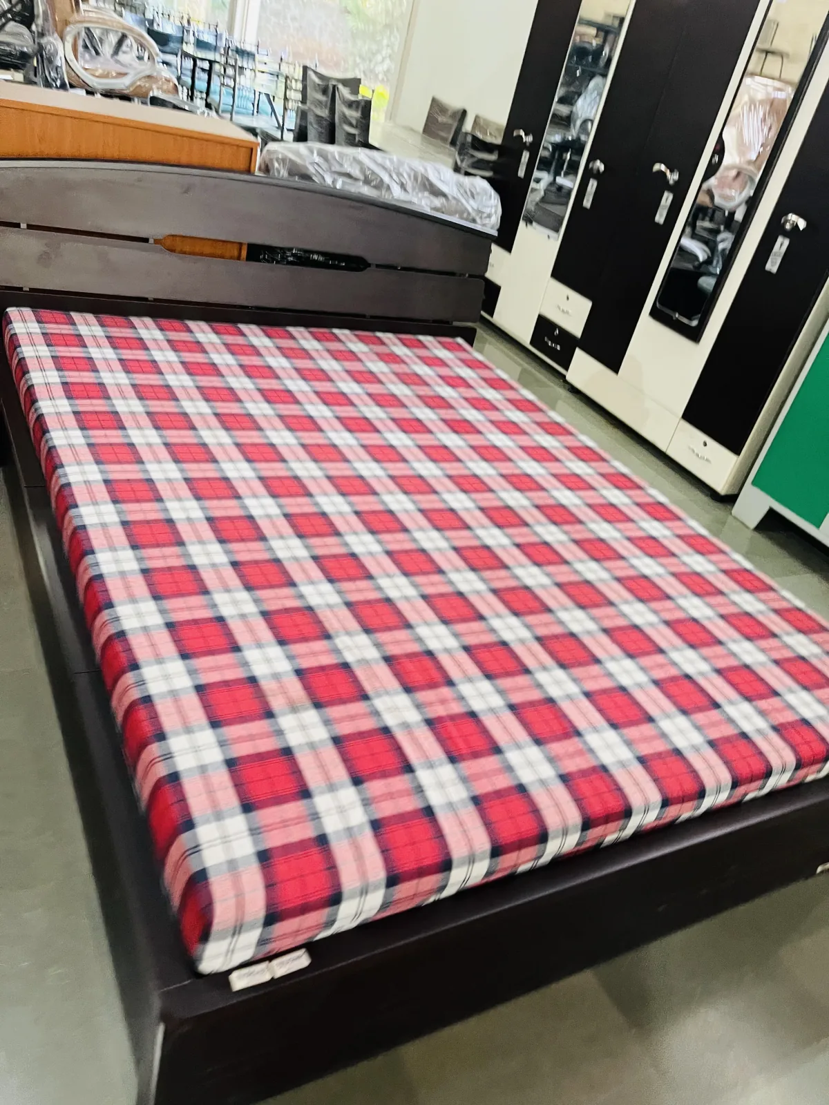 Steel double bed with a storage base.