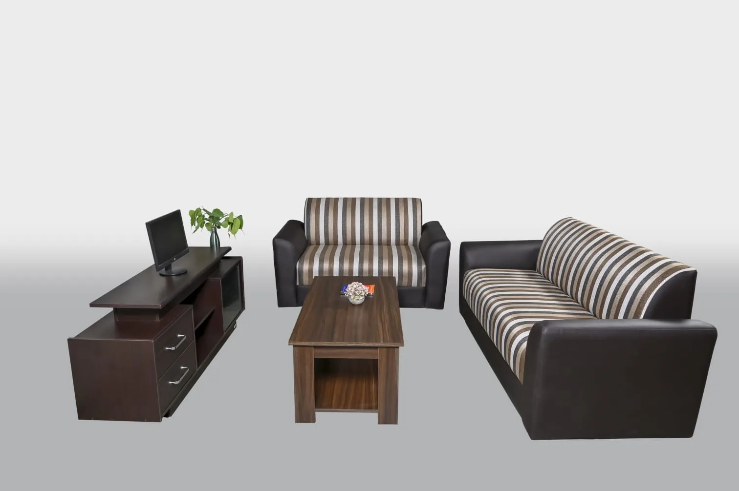 A living room: sofa set, television unit and a centre table.