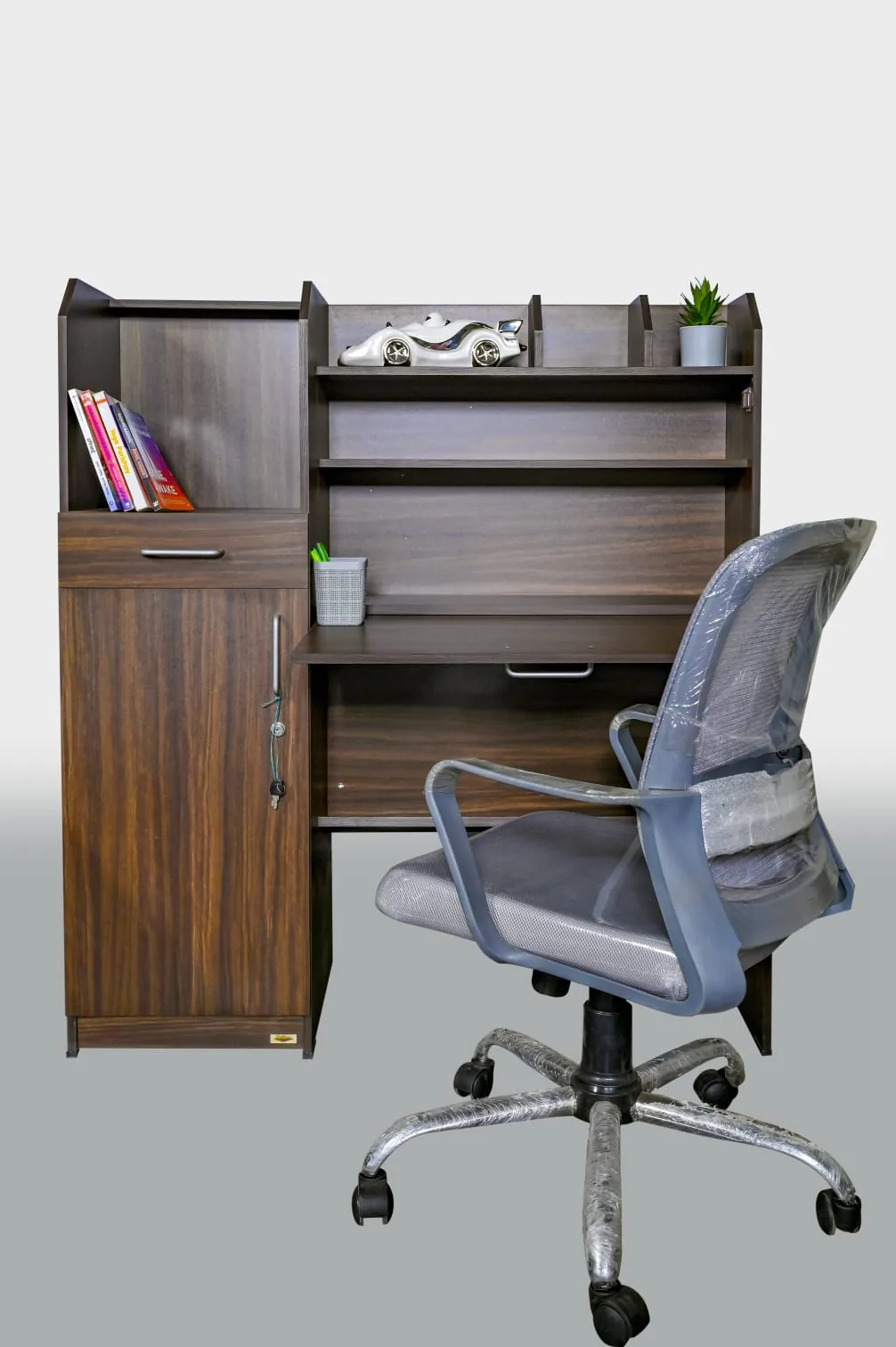 A study corner: desk with an overhead hutch, and a chair.