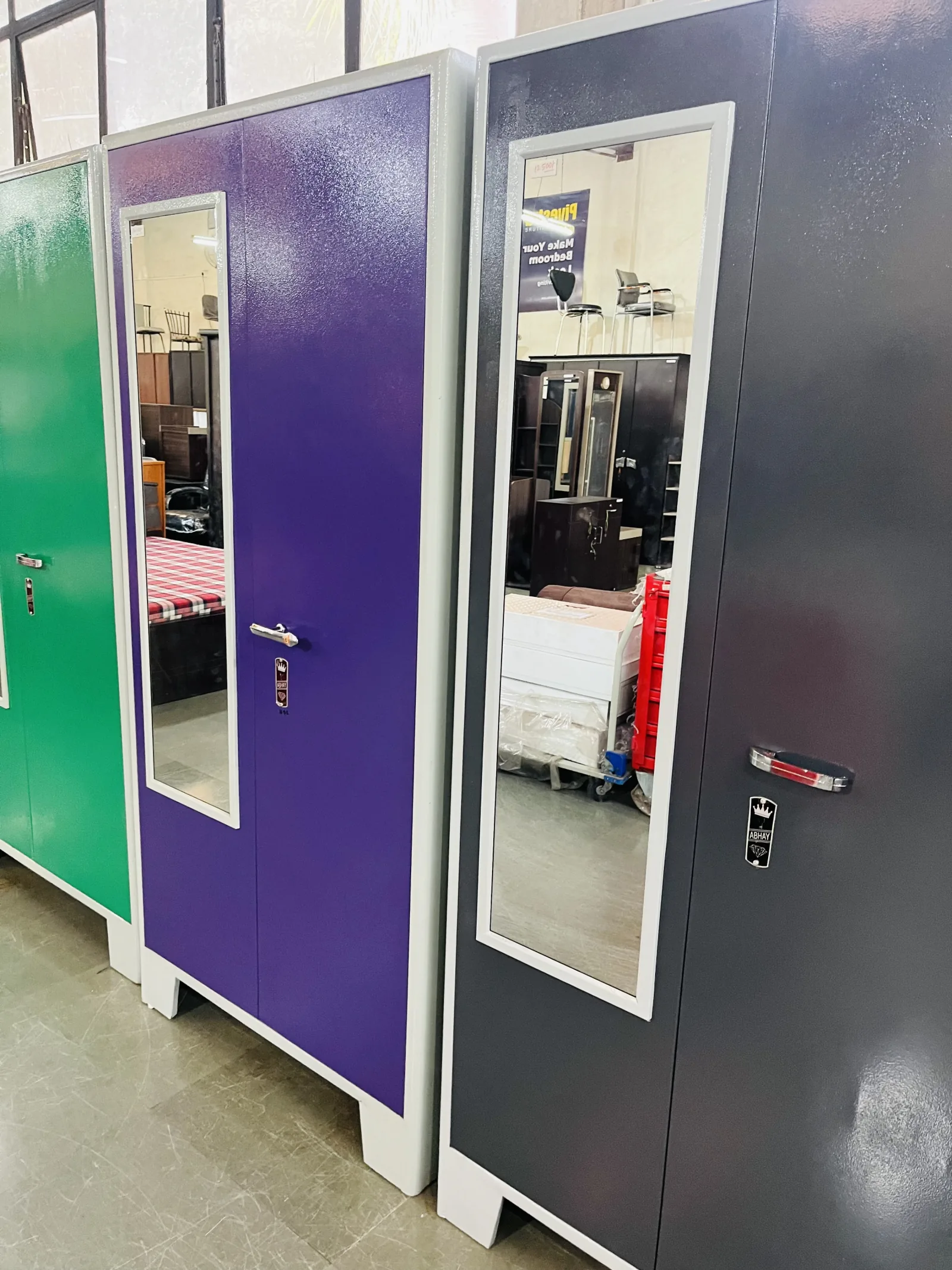 Cupboards on the showroom floor, in the colours we powder-coat.